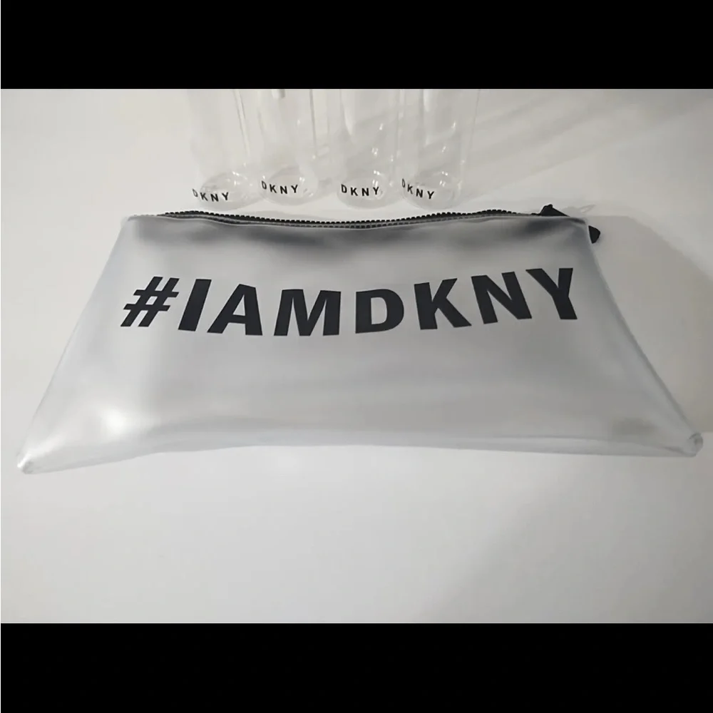 DKNY Clear Travel Bottle Set with White/Silver Pouch and Black Accents
